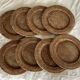 Set of round woven rattan and canework coasters