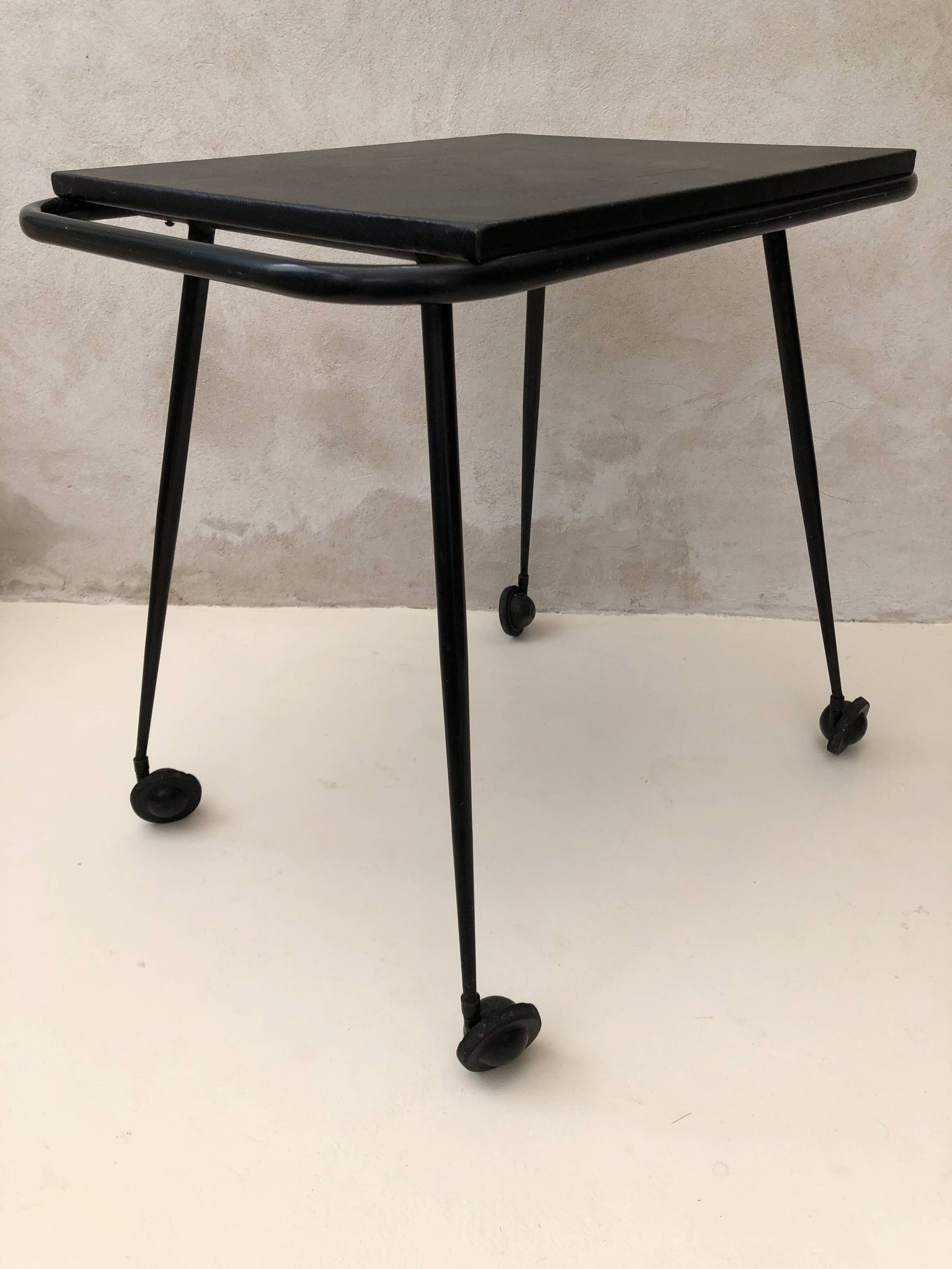 Black table on wheels from the 60s