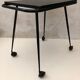 Black table on wheels from the 60s