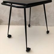 Black table on wheels from the 60s