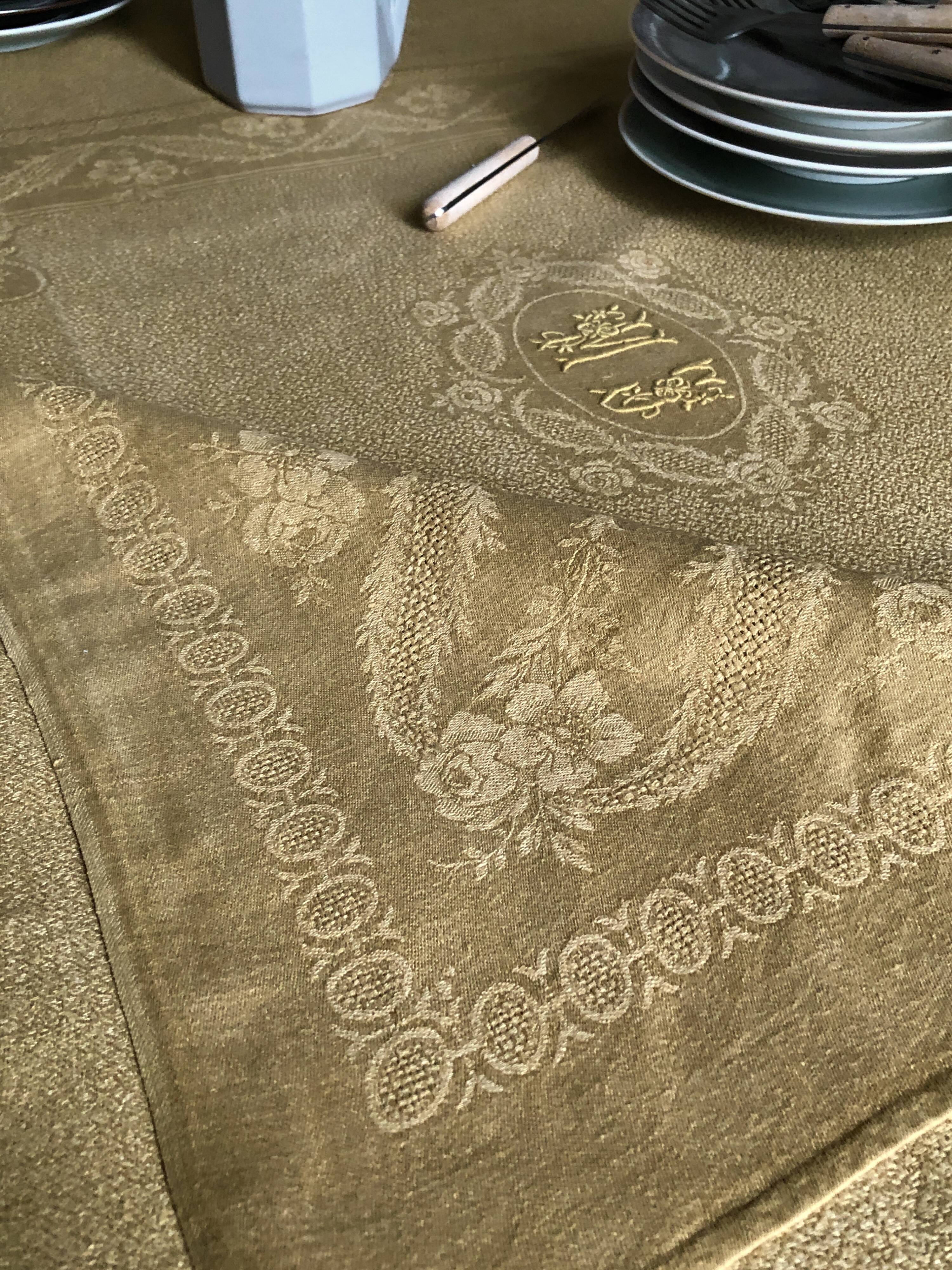 Old linen tablecloth and evening tinted in vermeil