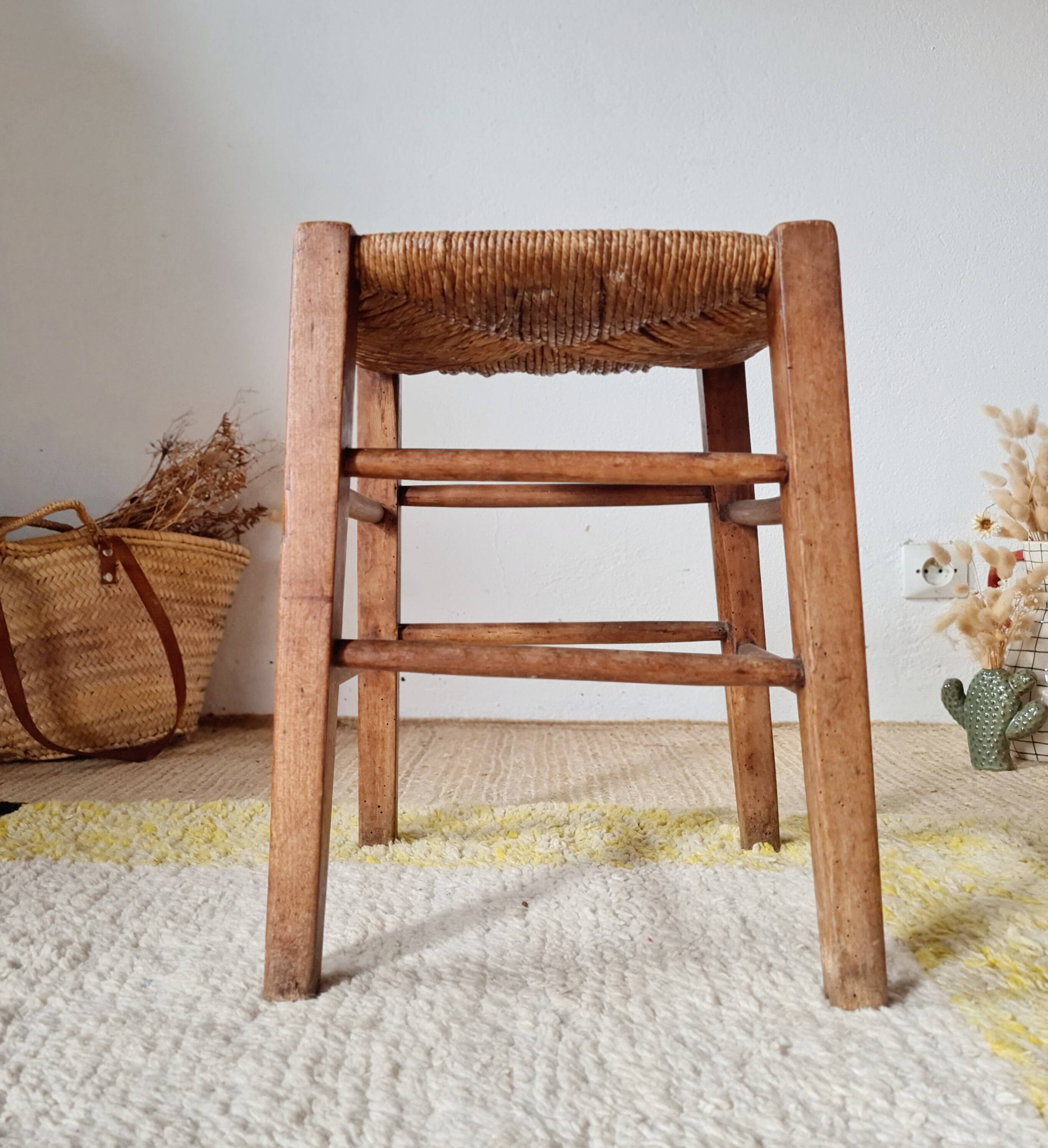 Old farmhouse stool made of wood and straw