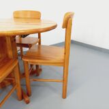 Suite of a round table with extension and 4 vintage pine chairs from the 60s and 70s
