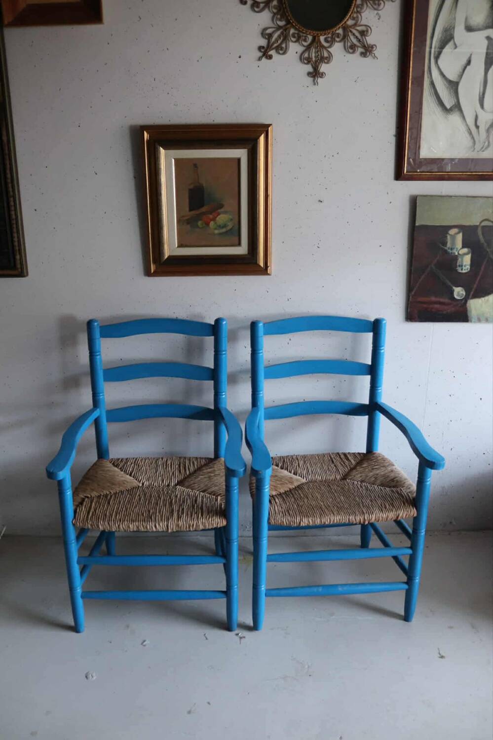 Pair of Provençal armchairs in painted wood and straw, around 1960.