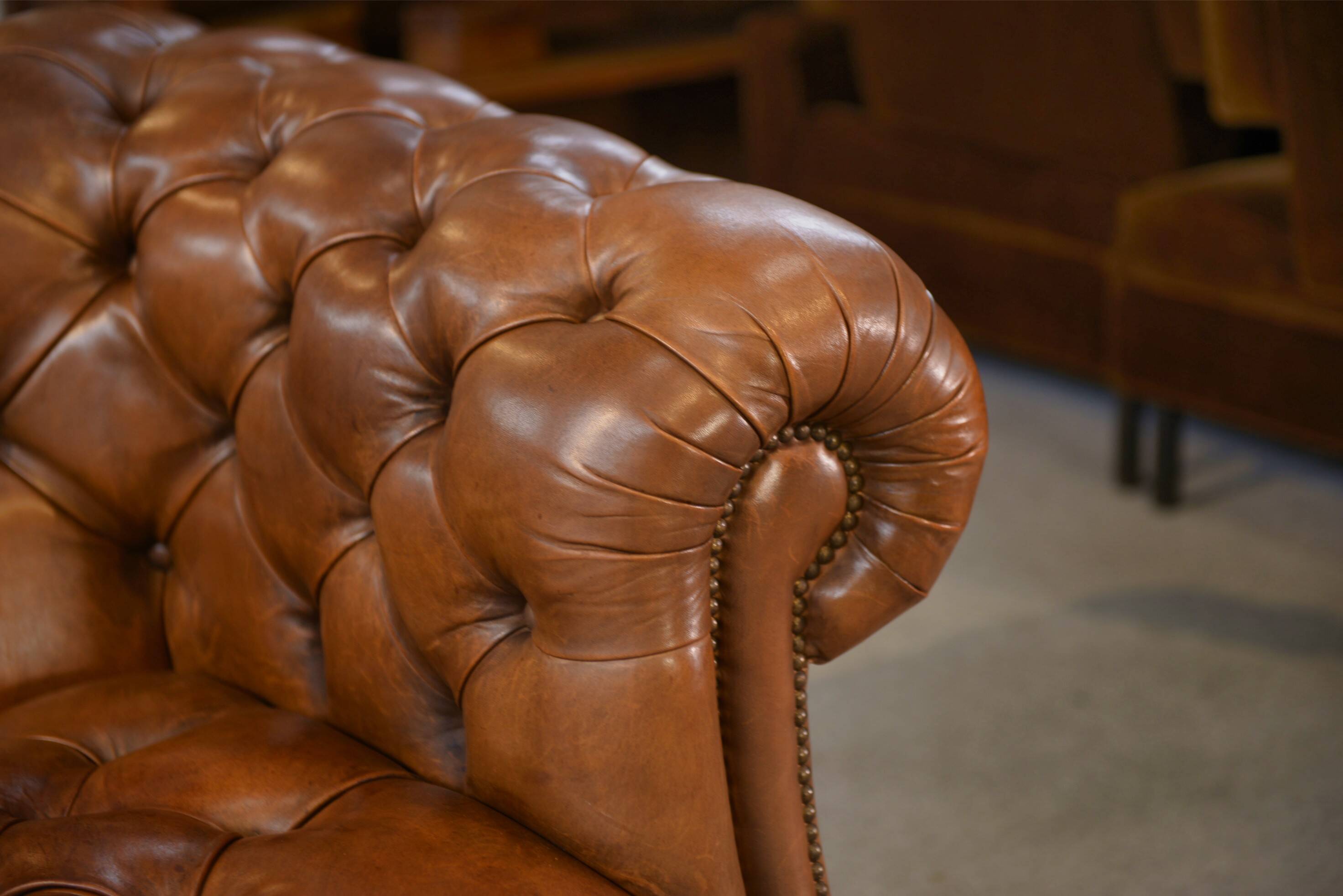 Tan leather tufted Chesterfield sofa