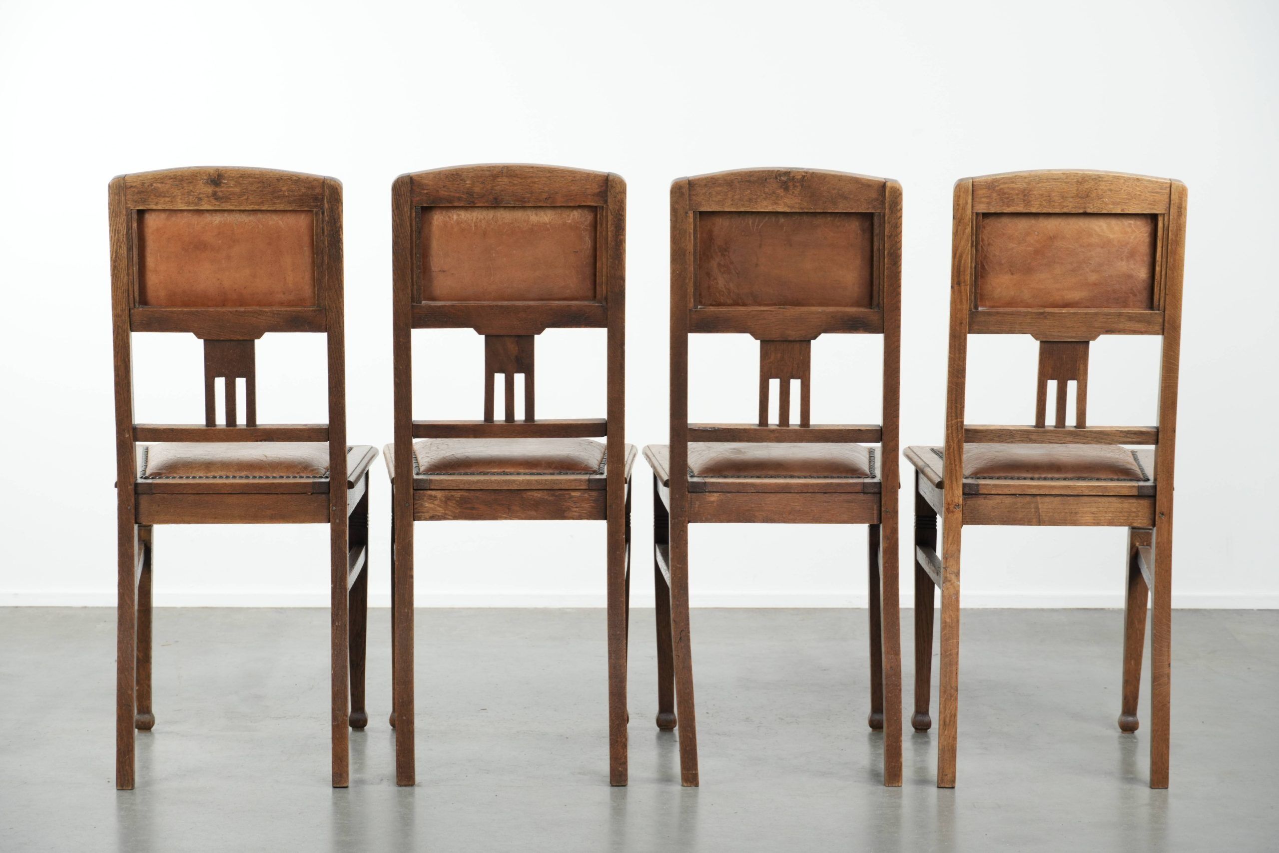 Set of 4 antique oak dining chairs in Art Nouveau style with sheepskin