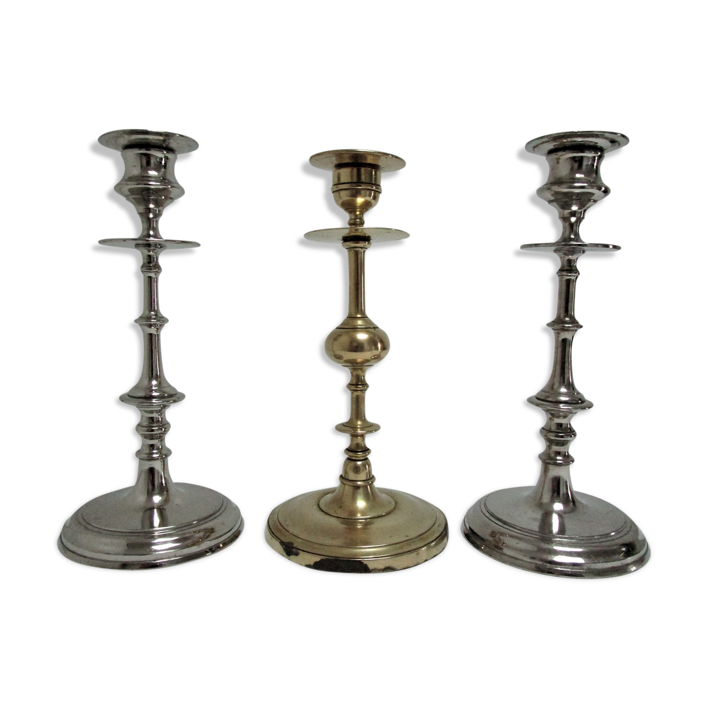 three brass and chrome candle holders early twentieth century