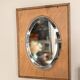 Bevelled oval mirror on oak frame