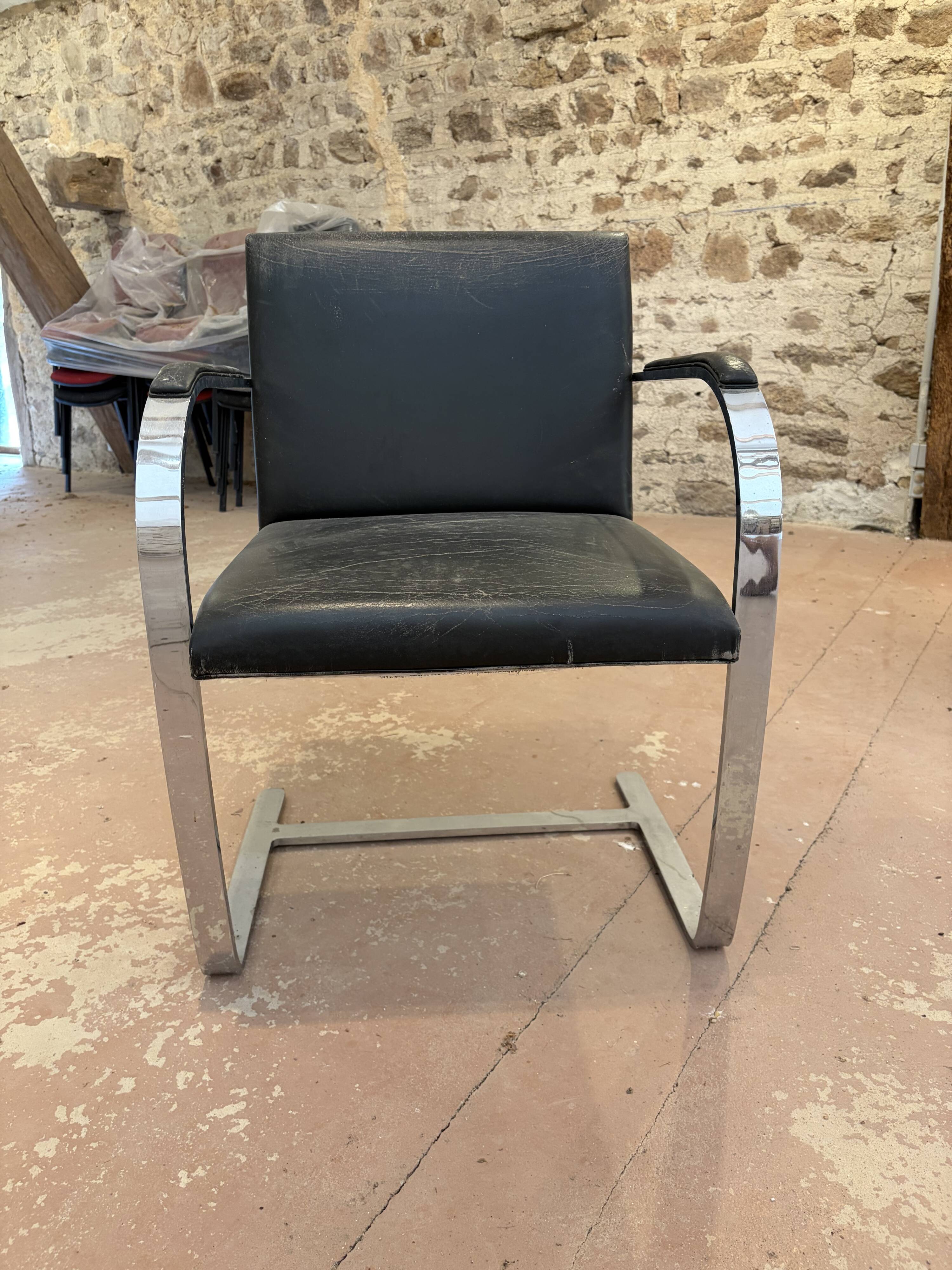 Pair of Executive Chairs by Knoll attributed to Charles Pollock in black leather.