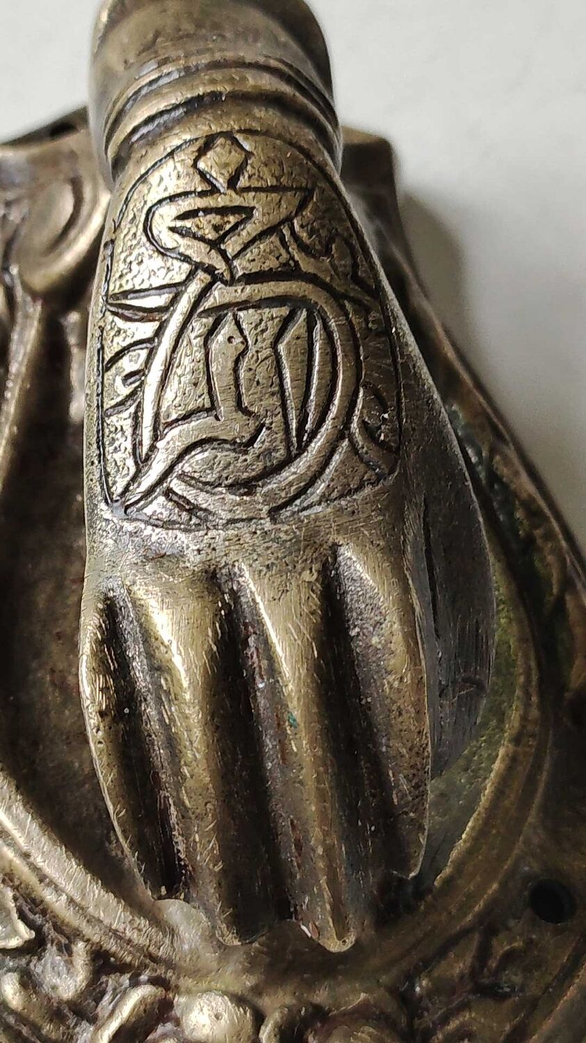 Door knocker in bronze