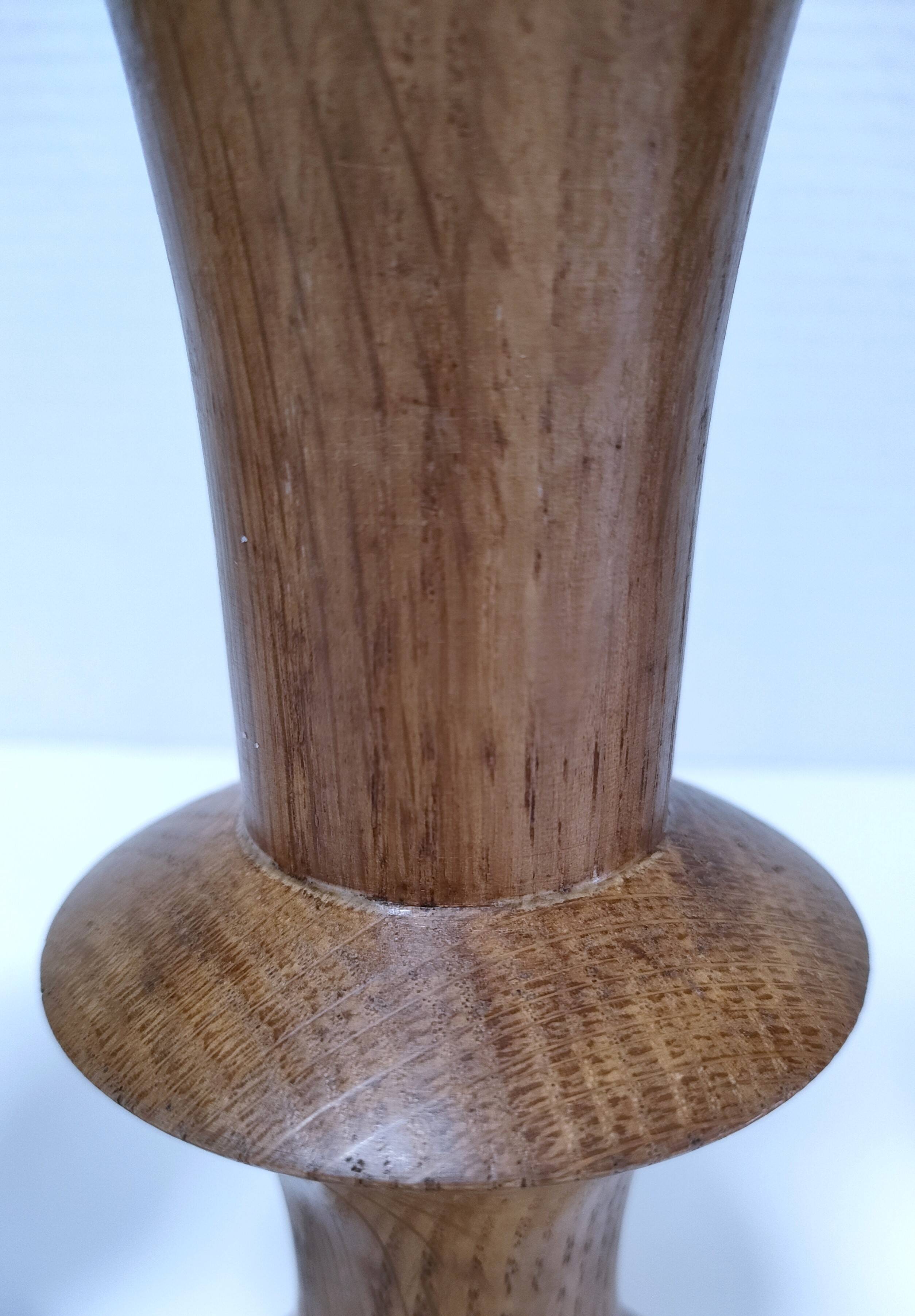 Three vintage patinated solid wood candlesticks
