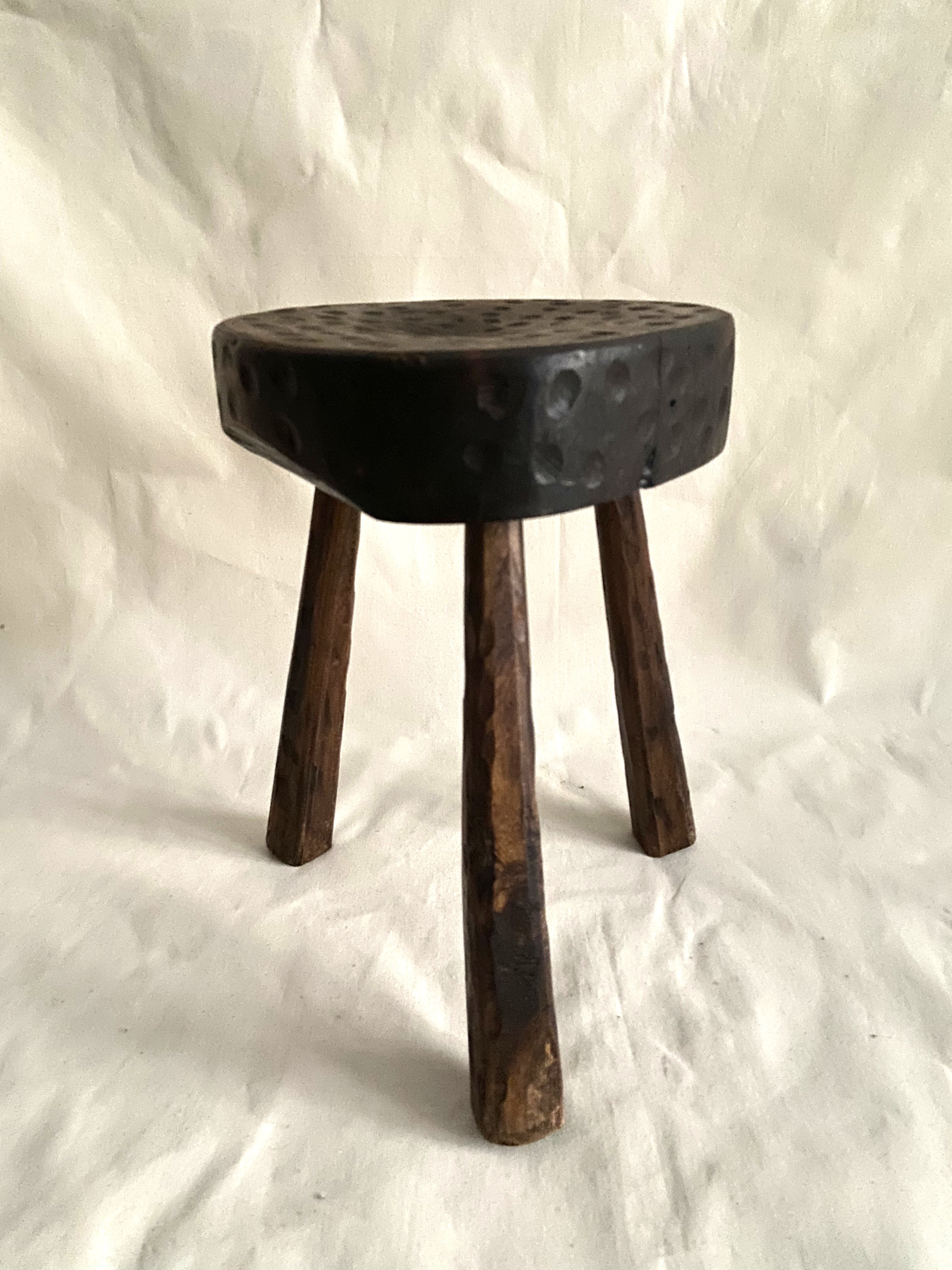 Brutalist tipode stool in carved wood