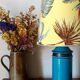 Blue ceramic lamp with claw feet and foliage lampshade.