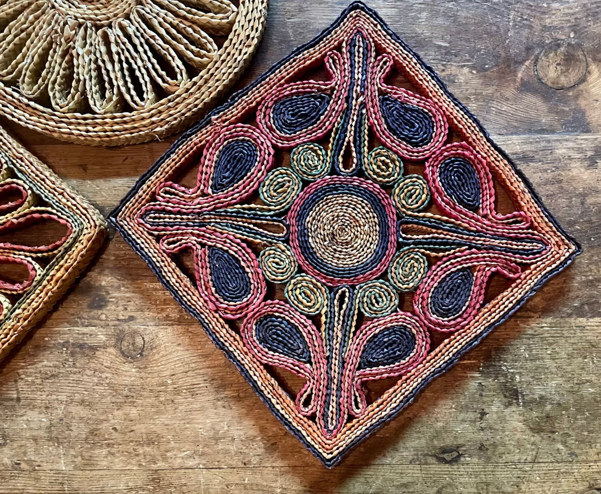 3 woven straw trivets