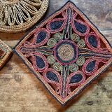 3 woven straw trivets