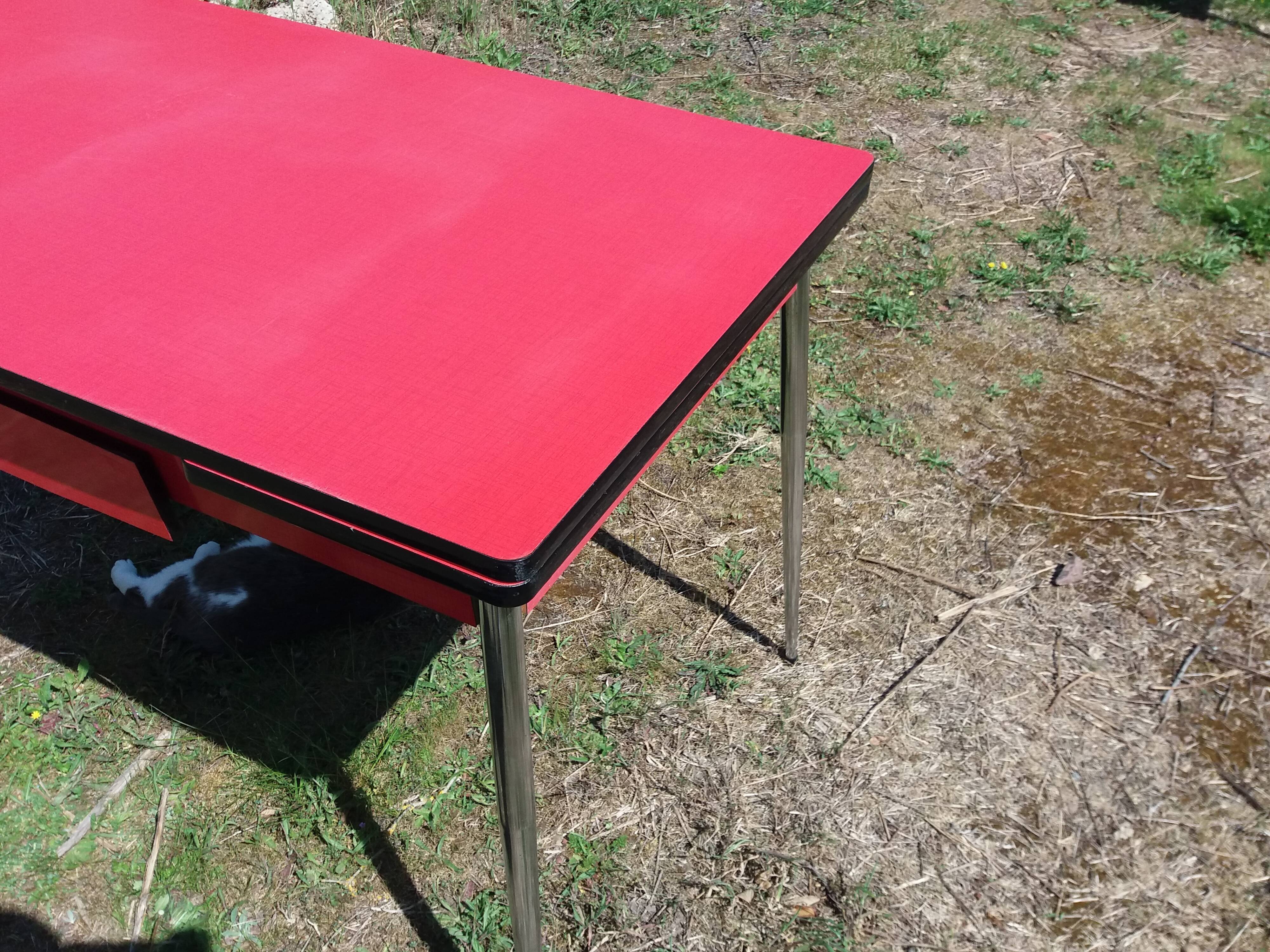 Dining table with red formica extensions