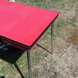 Dining table with red formica extensions