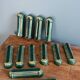 Poët Laval knife rest in emerald green ceramic and gold.
