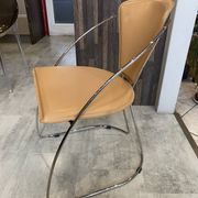 1 Linda armchair chair by Arrben in camel brown leather with a chrome steel frame.