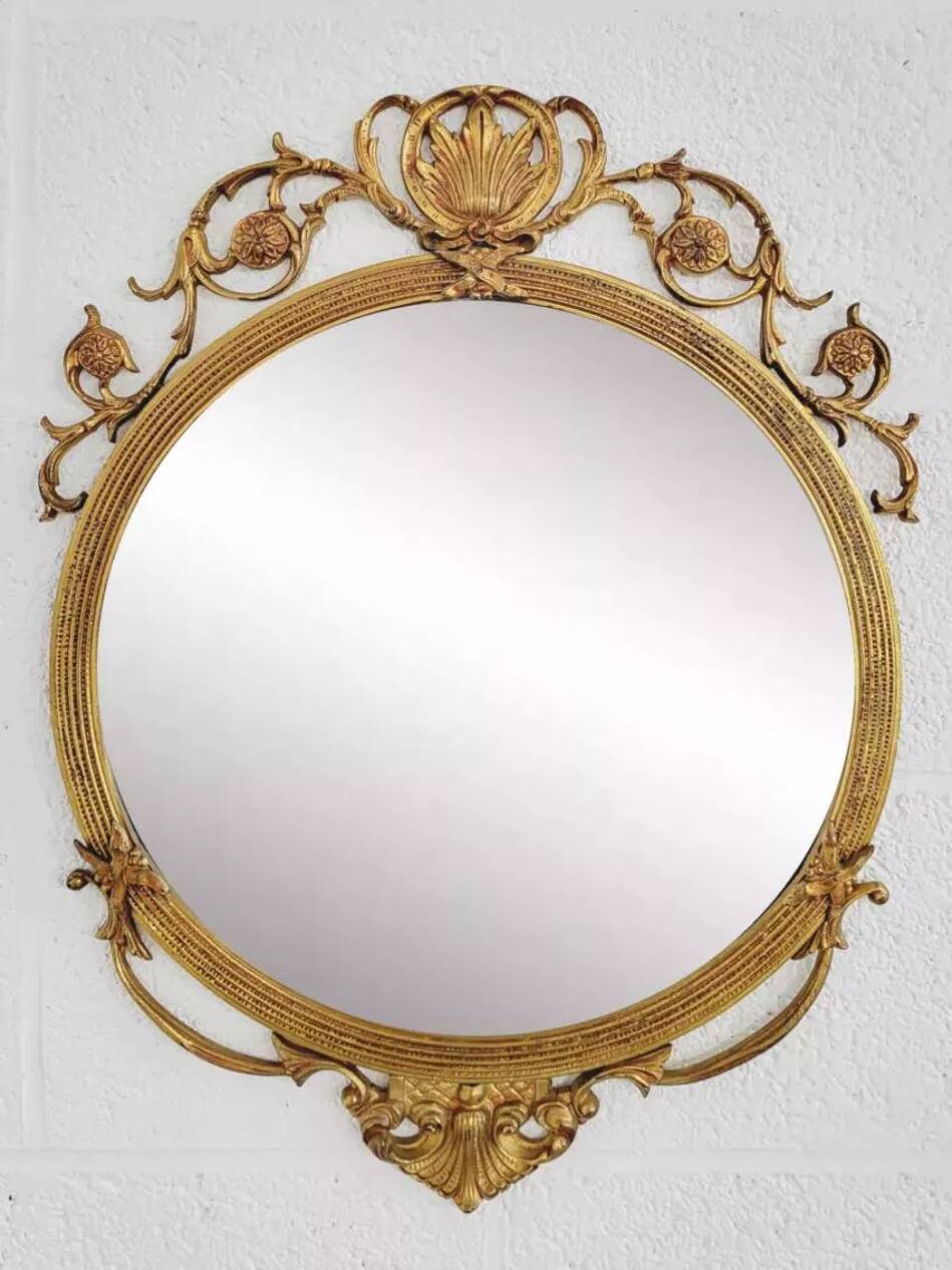 Round brass medallion style mirror