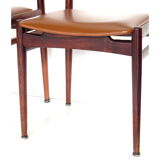 Set of four vintage mid century rosewood dining chairs with cognac leather seats
