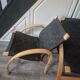 pair set of 2 armchairs with a wooden frame and black fabric weaving