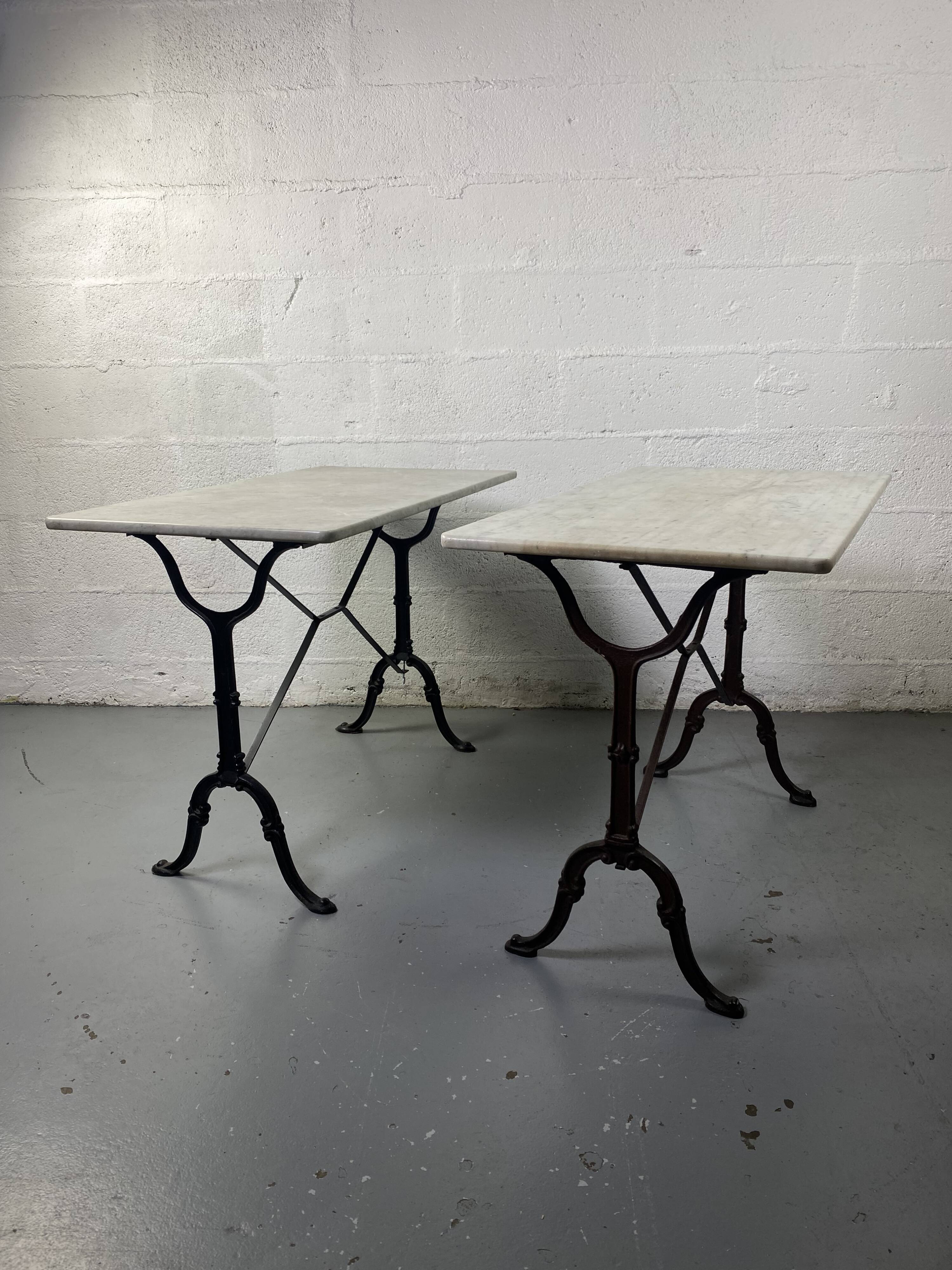 Set of two bistro tables in marble and wrought iron
