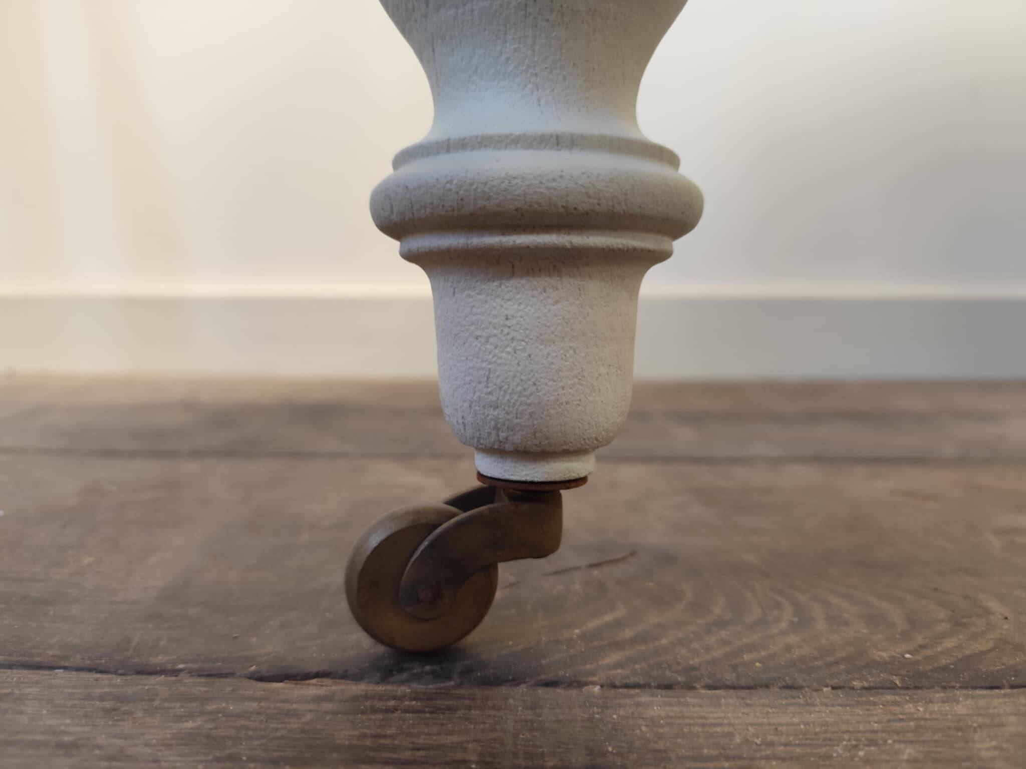 Round walnut table convertible into a console.