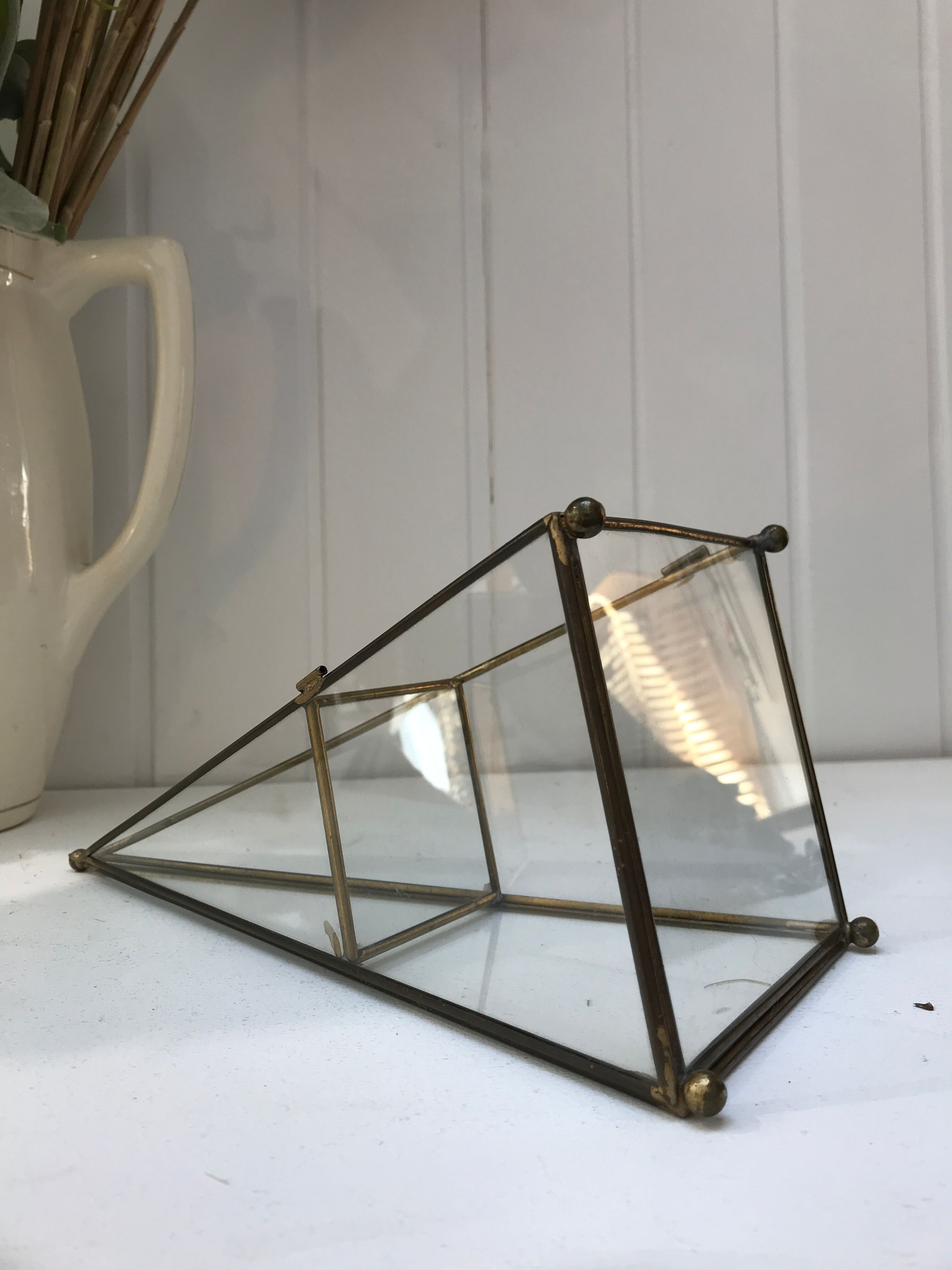 Brass pyramid showcase