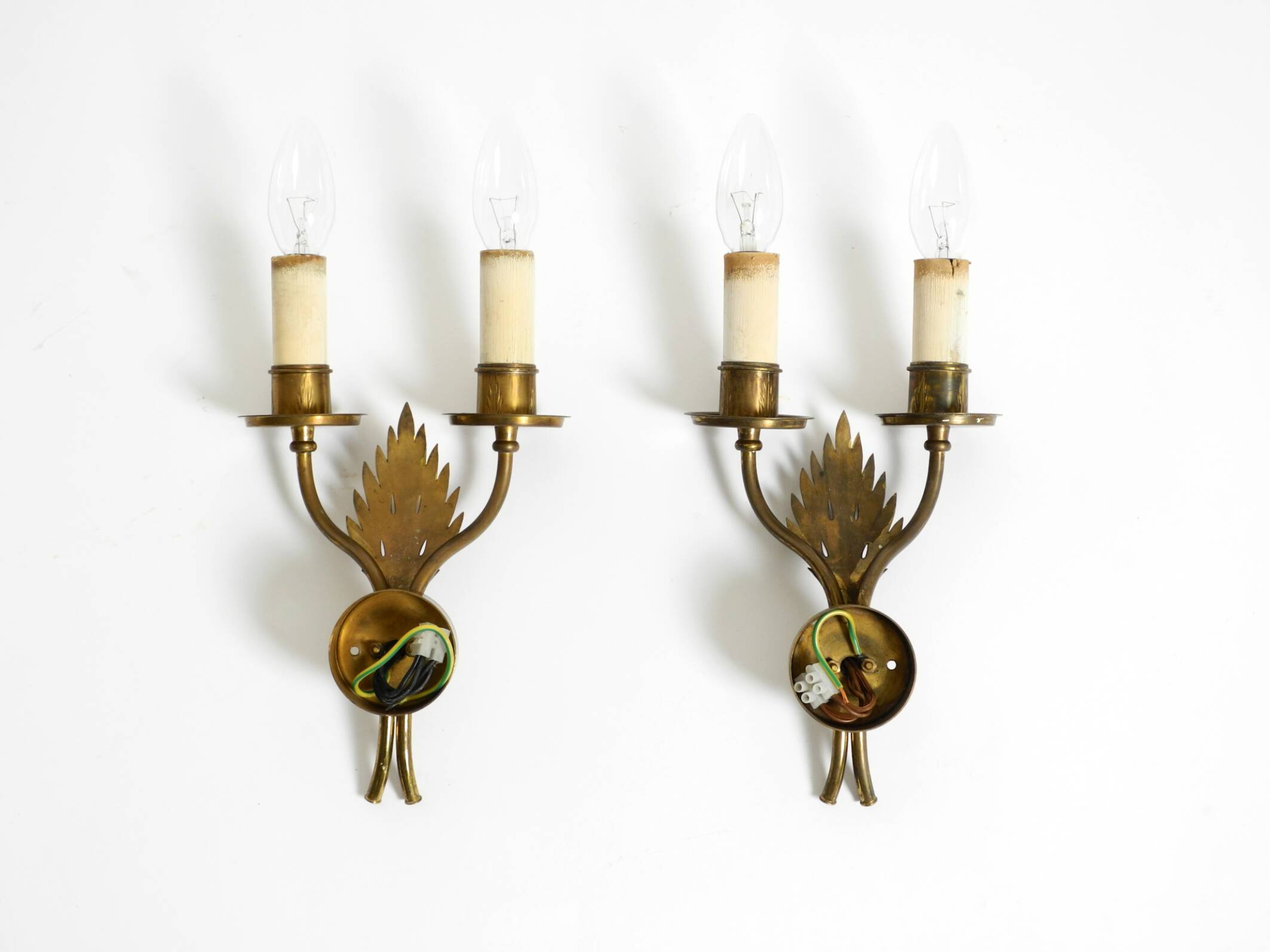 A pair of mid-century modern brass wall lamps by Vereinigte Werkstätten