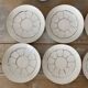 White and silver Limoges porcelain coffee cups and saucers.