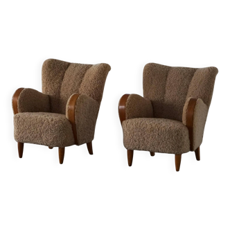 Pair of Danish Art Deco modern lounge chairs in sheepskin with lambswool and elm, 1940s.