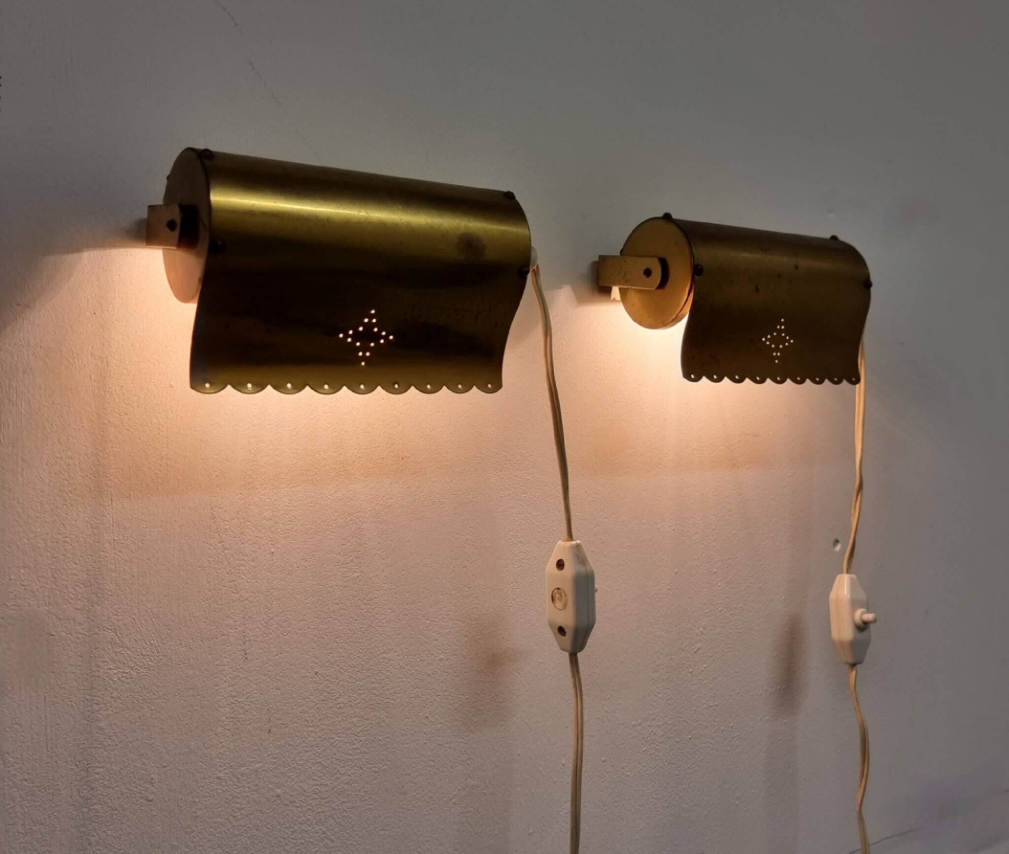 A pair of charming wall sconces/branches in brass with a star pattern, modern Scandinavian style.