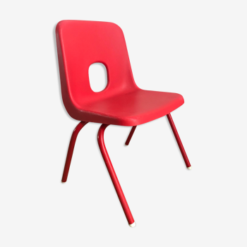Red child chair by robin day for ikea