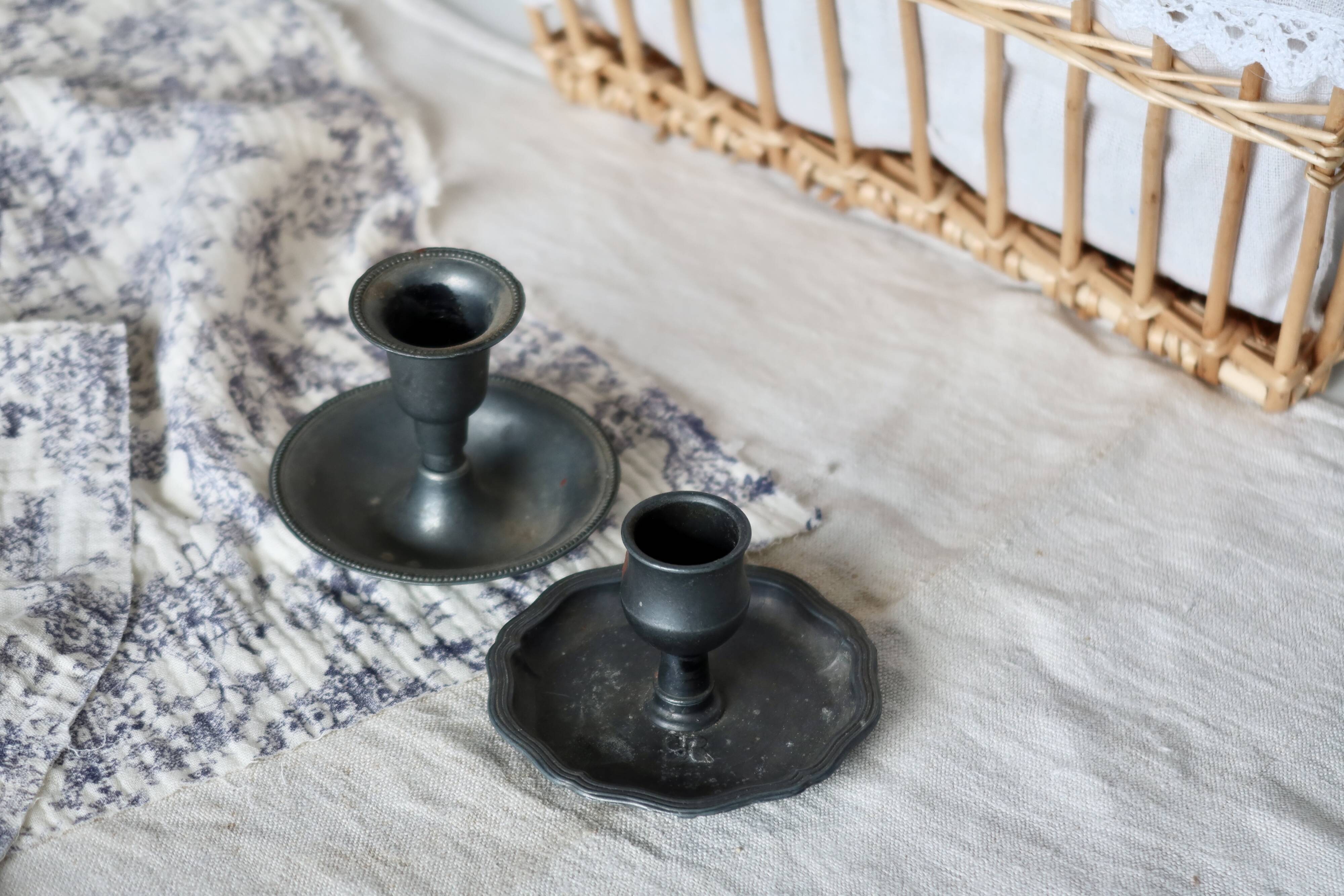 Pair of mismatched vintage silver-plated candlesticks