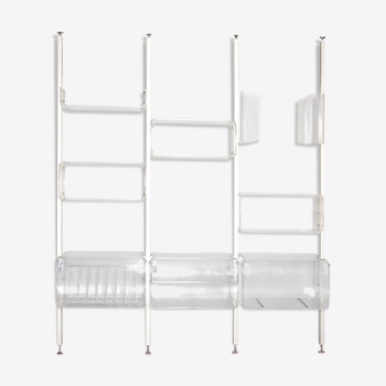 Michel Dumas's modular shelf in transparent Plexi and metal profiles