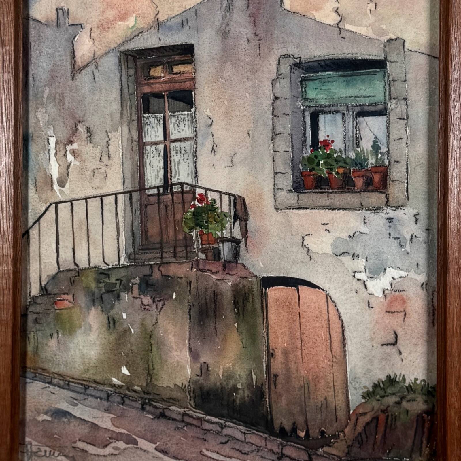 Watercolour on paper depicting the entrance of a house from the early 20th century.