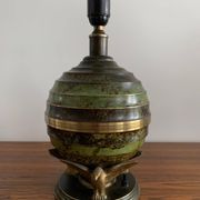 Art Deco table lamp in patinated bronze with eagles holding a globe, France 1940.