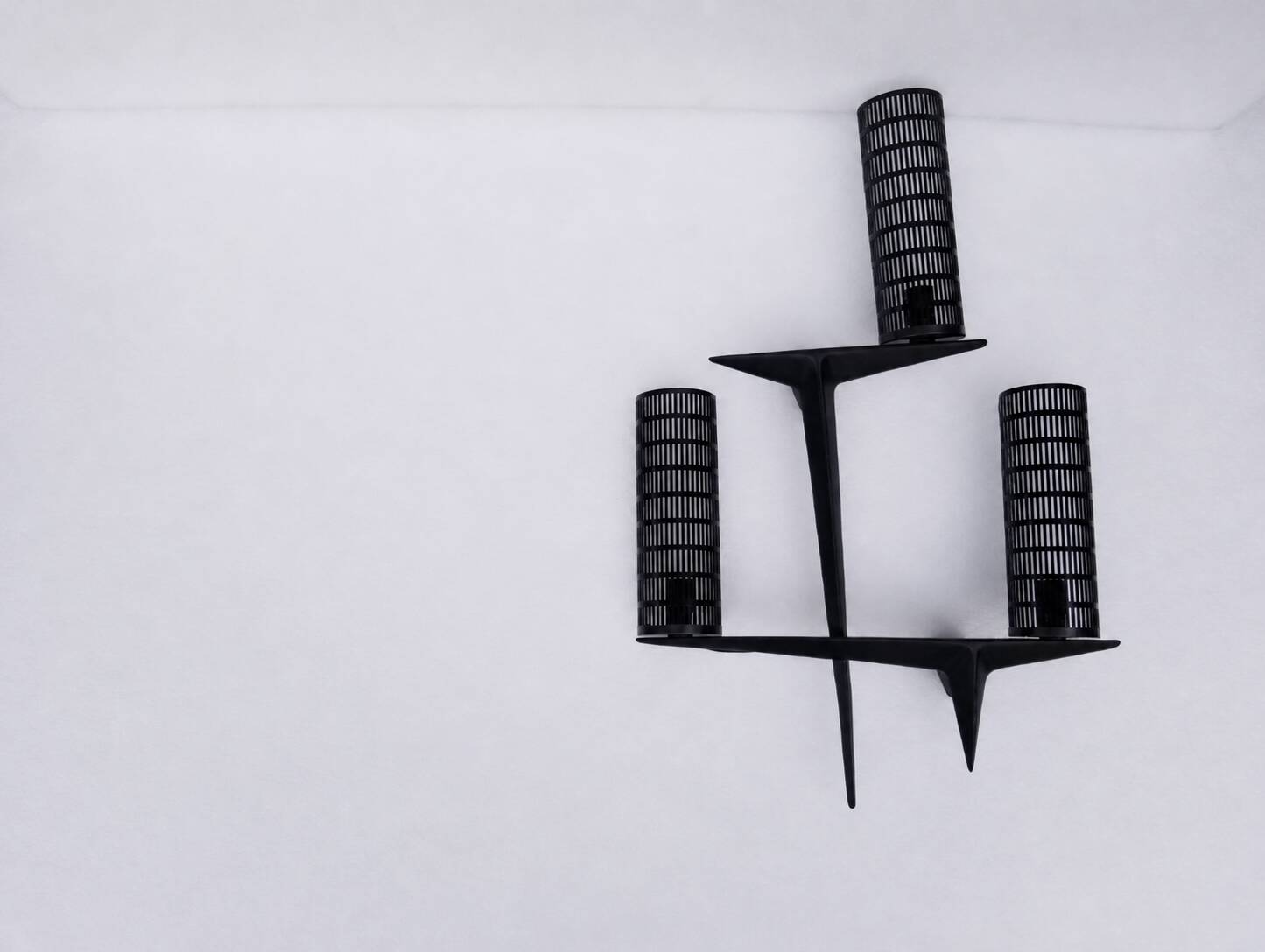 Pair of sculpted lacquered bronze wall lights, Arlus