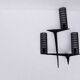 Pair of sculpted lacquered bronze wall lights, Arlus