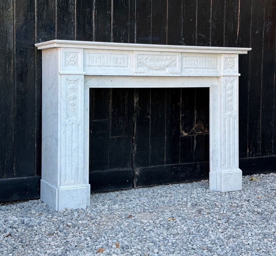 Louis XVI style fireplace in white Carrara marble, circa 1880.