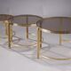 Set de trois tables basses gigognes en bronze et verre fumé, années 70