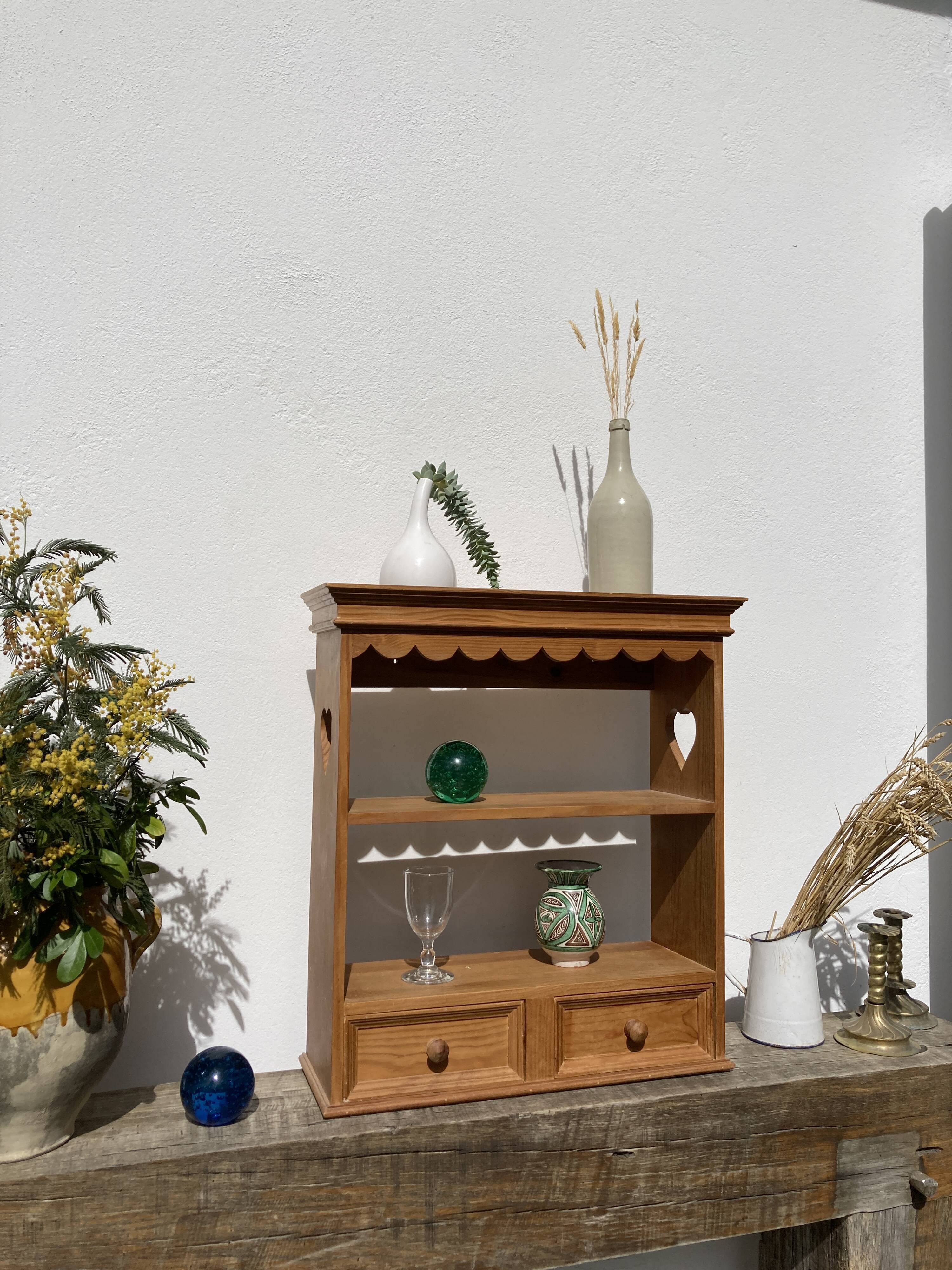 Wall shelf in raw wood with drawers and openwork hearts