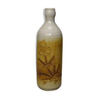 Bottle decorated with Vallauris foliage