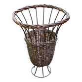 Vintage umbrella stand in rattan, woven wicker, and steel.