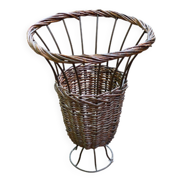 Vintage umbrella stand in rattan, woven wicker, and steel.