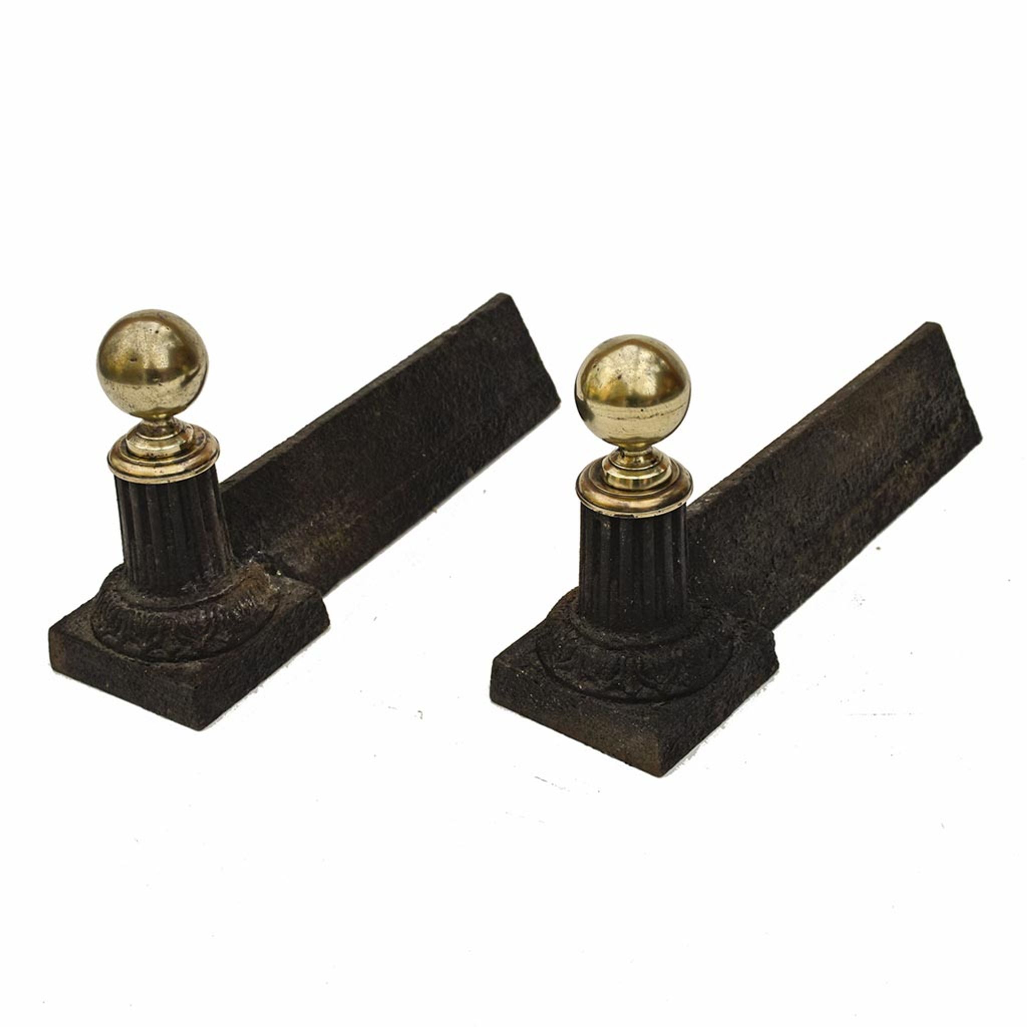 Pair of cast iron channels and brass ball 19th antique fireplace accessory
