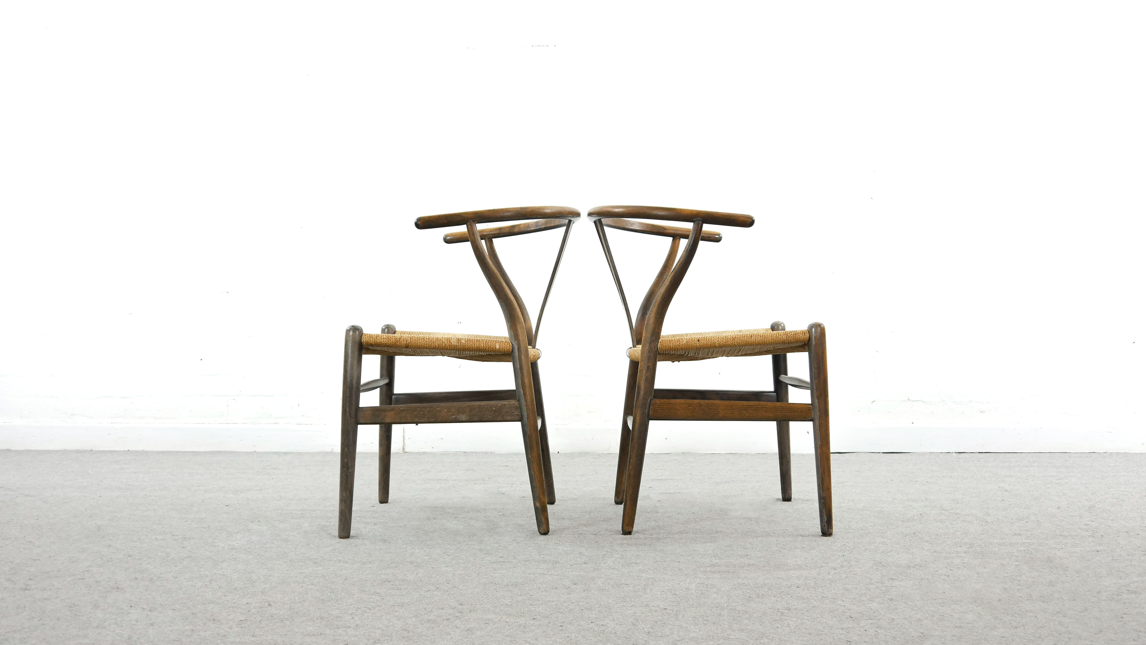 Pair of CH24 wishbone dining chairs by Hans Wegner for Carl Hansen Denmark