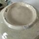 Two large vintage bowls in pastel decor on mini pedestals.