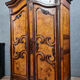 Bressane wardrobe Louis XV era with gendarme's hat in walnut and elm around 1750